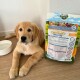 Ein Golden Retriever Welpe liegt neben einem Sack Bellfor Premium-Hundefutter, beschriftet mit "FREILAND-SCHMAUS JUNIOR", mit einer Wasserschüssel in der Nähe.