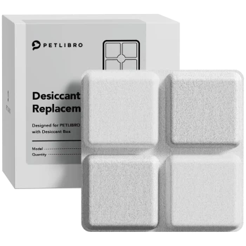 PETLIBRO-Trockenmittel-Ersatzbox und vier weiße quadratische Trockenmittelblöcke, Verpackungstext 'Desiccant Replacement' sichtbar.