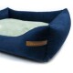 Marineblaues Haustierbett mit einem weichen grünen Zentrum und erhöhten Rändern, mit einem Lederschild, auf dem "RexProduct.com" steht.