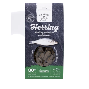 Packaging for "Go Native Grain Free Herring" dog treats, featuring a fish image, claims of 30% meat content, and "sustainably sourced."