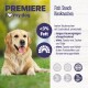 Ein glücklicher Golden Retriever sitzt auf dem Gras neben einer Anzeige für "Premiere Fish Snack Kauknocken", die fettarm, langanhaltend und ohne Zusatzstoffe ist.