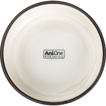 Ceramiczna miska dla zwierząt z kremowym wnętrzem i ciemnym brzegiem, z logo "AniOne Wild variety" na środku.