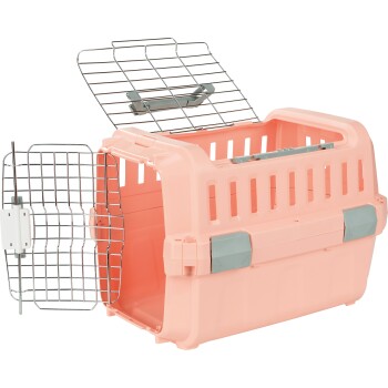 Transporteur pour animaux de compagnie rose avec une porte en métal, comportant une ouverture supérieure et des fentes de ventilation sur les côtés.