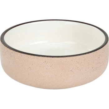 Keramische Futterschale für Haustiere mit strukturiertem rosa Äußeren und glattem weißen Inneren, mit einem schwarzen Rand.