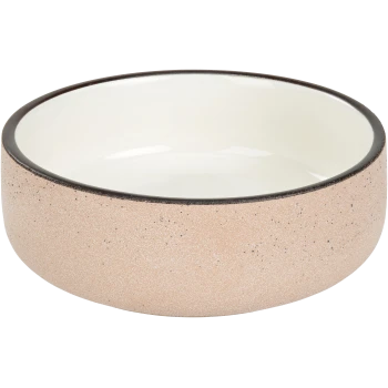 Bol en céramique pour animaux avec un extérieur rose texturé et un intérieur blanc lisse, présentant un bord noir.