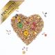 Herzförmige Anordnung verschiedener Samen und bunter Pellets, beschriftet mit "PREMIUM" in einem goldenen Banner.