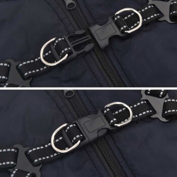 Nahaufnahme einer schwarzen Haustierjacke mit einem Reißverschluss und verstellbaren Riemen mit silbernen D-Ringen zur Leinenbefestigung.