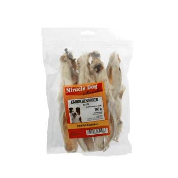 Klare Plastiktüte mit Miracle Dog Snacks Kaninchenohren Hundeleckerlis, 100g, mit Hundebild auf dem Etikett.