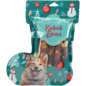 Thempa Kabob Bone Hundeleckerlis in festlicher Verpackung mit glücklicher Hundillustration und Weihnachtsdekoration, 215g.