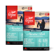 Zwei Beutel Orijen Small Breed Marine Fish Hundefutter vor einem Sonnenuntergang, die "85% Qualitäts-Tierzutaten" und "Wholeprey-Diät" präsentieren.