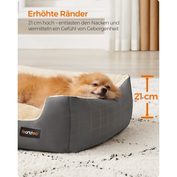 Ein schlafender Pomeranian ruht sich in einem gemütlichen grauen Haustierbett mit erhöhten Rändern aus, mit Text über die Höhe des Bettes (21 cm) und den Komfort.