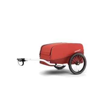 Roter Haustieranhänger mit einem weißen Rahmen und einem Rad, mit dem Markennamen "CROOZER" an der Seite.