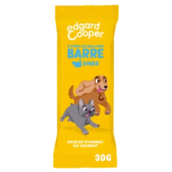 Emballage jaune vif pour la barre de friandises pour chiens d'Edgard Cooper, présentant un chien brun et gris. Texte : "À FOND LES BALLONS BARRE DINDE," "30G."