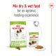 Royal Canin X-Small adult dog food packaging, featuring a bag of dry food and a can of wet food, with text promoting mixing for optimal feeding.