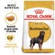 Royal Canin Rottweiler Adult Hundefutterbeutel, mit einem Rottweiler-Bild, und Text, der die Rassenernährung und Herzgesundheit hervorhebt.