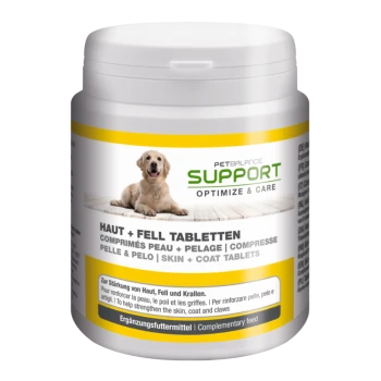Container of PetBalance Support Skin + Coat Tablets for pets, featuring a golden retriever on the label, with multilingual text on benefits.