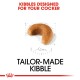 Kibble shaped like a crescent, labeled "Tailor-Made Kibble" with the text "Kibbles Designed for Your Cocker" above it.
