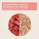 Schüssel, die in zwei Teile geteilt ist: eine Seite mit frischen Rindfleischstücken, die andere mit gesundem Rindfleischinnereien, mit Text auf Deutsch und Englisch darüber.