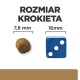 Obraz porównujący rozmiar krokietów karmy dla zwierząt (7,8 mm) obok niebieskiej kostki (16 mm) z tekstem 'ROZMIAR KROKIETA' powyżej.