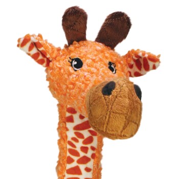 Orange curly plush giraffe toy with spotted neck, large stitched snout and brown horns
