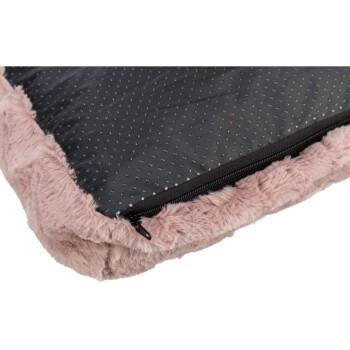 Eine Nahaufnahme eines Haustierbettes mit einem weichen rosa Kunstfellrand und einem schwarzen, gesteppten Zentrum mit einem Reißverschluss.