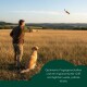 Oranger Canvas-Hundetrainingsdummy mit grünem Knebelverschluss und Seil, beschriftet mit "R R" und "Quimera"-Etikett.