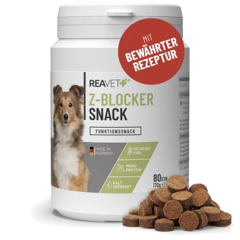 Behälter mit REAVET Z-Blocker Snack Hundeleckerlis mit Hundeabbildung, deutschem Text und einem Haufen runder brauner Leckerlis.