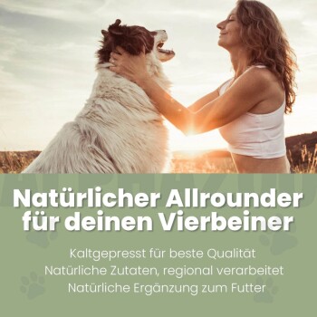 Schwarzkümmelöl für Hunde in schwarzer Flasche mit Text: "100% rein", "Unterstützt die Verdauung", "Kaltgepresst".