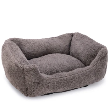 Lit pour animaux en peluche grise avec des côtés surélevés et un centre doux et rembourré, idéal pour les petits chiens ou les chats.