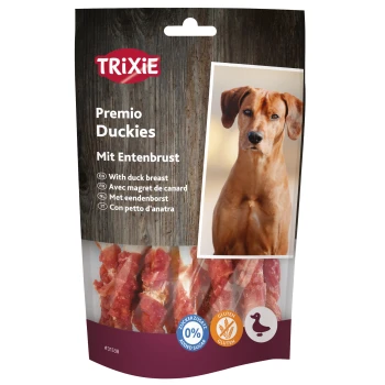 Duckies Ente 100g Packung von TRIXIE Premio Duckies Hundeleckerlis mit Entenbrust, mit einem Holz-Hintergrund und Symbolen, die 0% Zuckerzusatz und glutenfrei anzeigen.