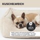 Orthopädisches Hundebett mit Memory-Schaum, gepolsterten Seitenkissen und blauer, wellenförmiger Unterlage.