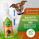 Hund hält Zahnbürste neben einer Sprayflasche von Baviette, sichtbare Texte: 'Zahnreiniger für Hunde', 'Baviette Micronimal 982', 'geruchslos', '100% natürliche Inhaltsstoffe'