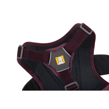 Hundegeschirr in Kastanienbraun und Schwarz, mit einem zentralen Logo eines Hundes auf gelbem Hintergrund.