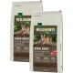 Zwei Tüten Real Nature Wilderness Black Earth Katzenfutter, mit einer Katze auf einem Baumstamm, mit Text, der 70% Fleisch und 30% Gemüse hervorhebt.