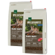 Dwie torby karmy dla kotów Real Nature Wilderness Black Earth, z kotem na kłodzie, z tekstem podkreślającym 70% mięsa i 30% warzyw.