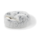 Cozy round pet bed in soft gray fur with plush white interior, designed for small dogs or cats.