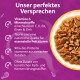 Schale mit Nassfutter (Fleisch, Erbsen, Karotten) neben einem lila Feld mit der Aufschrift 'Unser perfektes Versprechen' und deutschem Text.