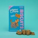 Boîte de biscuits Edgard Cooper Bravo avec des chiens de dessin animé, avec le texte "Crunch Crunch" et "130 Biscuits," accompagnée de friandises en forme de chien.