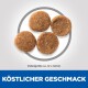 Vier runde Haustierfutterpellets auf einem hellen Hintergrund dargestellt, mit einer Größenangabe von etwa 12 x 12 mm und dem Text "KÖSTLICHER GESCHMACK."