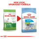 Image of two Royal Canin dog food bags side by side, labeled "Junior" and "Puppy X-Small," with text "NEW LOOK, UPGRADED FORMULA."