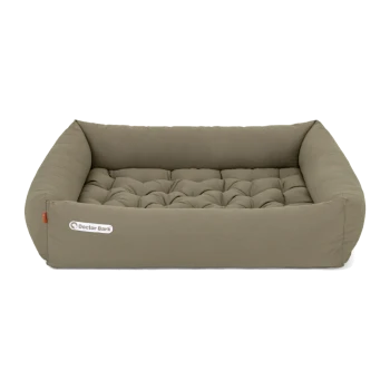 Ein plüschiges, rechteckiges Hundebett in einem sanften Taupe-Ton, mit einem gepolsterten Design und dem Logo "Doctor Bark" an der Seite.