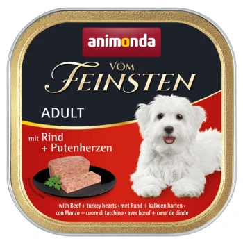 Boîte de nourriture humide pour chien avec un chien blanc sur le devant, étiquetée "animonda vom Feinsten Adult mit Rind + Putenherzen" et une portion de viande.