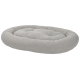 Lit pour animal de compagnie en peluche gris en forme ovale avec bords surélevés et surface douce et texturée.