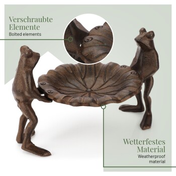 Ein dekoratives, froschförmiges Vogelbad aus wetterfestem Material, mit zwei Fröschen, die eine blattförmige Schale stützen.