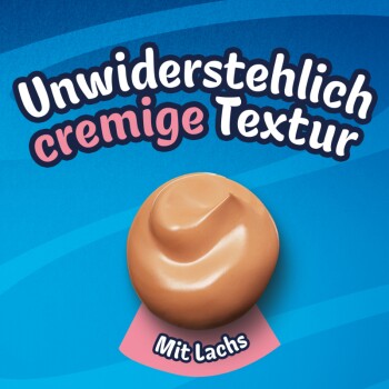 Kleckser cremigen Tierfutters mit Lachs auf blauem Hintergrund mit dem Text 'Unwiderstehlich cremige Textur' und 'Mit Lachs'.