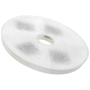A round, white pet filter with a central hole, featuring a soft, fuzzy texture and dark spots, designed for pet care products.