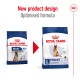 Royal Canin dog food packaging comparison showing new design and optimized formula for Maxi Adult 5+ with digestive health benefits.
