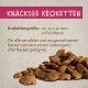 Fischöl, Biotin, Zink und Kupfer in einem Tropfen Öl; der Text beschreibt Vorteile für die Haut und das glänzende Fell von Haustieren.