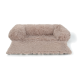 Lit pour animaux de compagnie doux et moelleux de couleur beige clair avec des côtés surélevés pour le confort et le soutien, idéal pour les petits à moyens animaux.