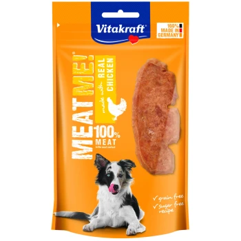 Hundeleckerli-Verpackung zeigt einen Border Collie, der sich die Nase leckt, und Hähnchen-Jerky, mit "100% FLEISCH," "ECHTES HÄHNCHEN," und "korn-/zuckerfrei."